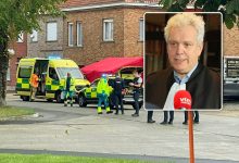 Police officers at the scene of a triple stabbing in Roeselare