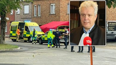 Police officers at the scene of a triple stabbing in Roeselare