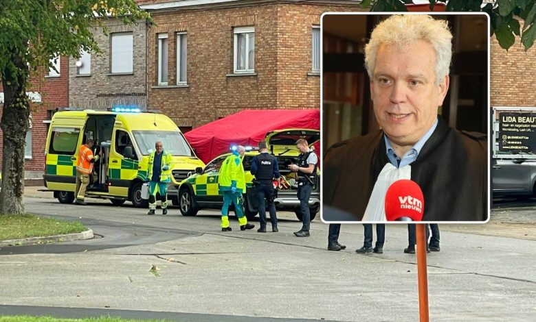 Police officers at the scene of a triple stabbing in Roeselare