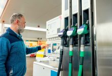 Customer paying for fuel at a gas station in Belgium