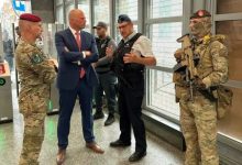 Belgian military personnel supporting police security operations at Brussels train and metro stations
