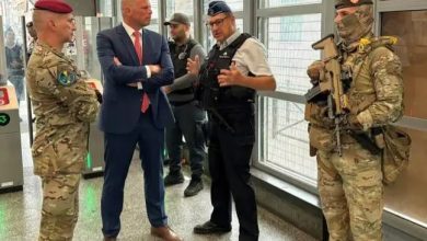 Belgian military personnel supporting police security operations at Brussels train and metro stations