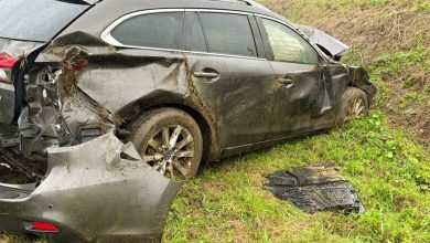 Car in the central reservation of the A19 motorway in Zonnebeke after an accident during heavy rain