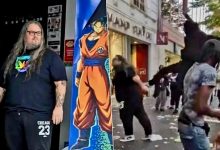 Pierre Collin standing outside the damaged Micromania video game store in Nice after looters attacked the business.